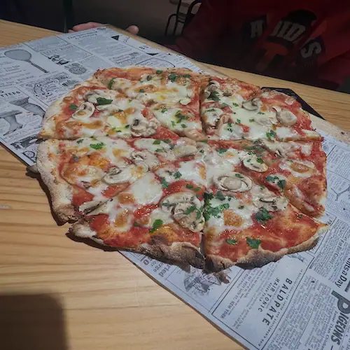 Freshly baked pizza on table